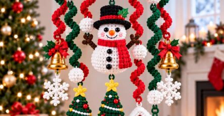 Crocheted Christmas mobile with snowman, Christmas trees, house, snowflakes, bells, and spiral garlands hanging from a wooden ring.