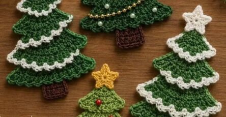 Four crocheted flat Christmas tree appliqués, each with a star on top, decorated branches, and textured details.