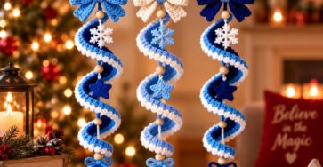 Three crocheted spiral Christmas ornaments in blue and white, featuring bows, wooden beads, snowflakes, stars, and hanging baubles.