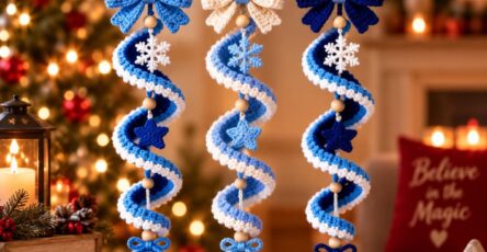 Three crocheted spiral Christmas ornaments in blue and white, featuring bows, wooden beads, snowflakes, stars, and hanging baubles.