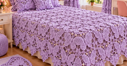 A bedroom decorated with a lavender crochet butterfly-themed bedspread, pillow covers, curtains, and a matching butterfly rug.