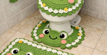 Crochet bathroom set with frog faces, lily pads, flowers, and a frog-shaped toilet paper holder.