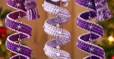 Three crochet Christmas ornaments: two purple-accented spiral snowmen and one spiral Christmas tree, all hanging as festive decorations.