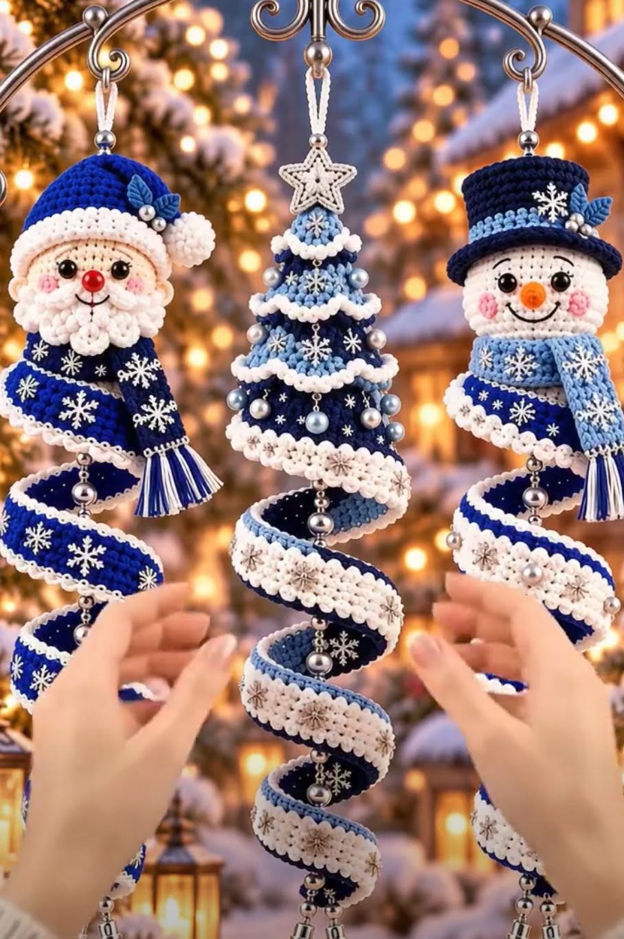 Three crocheted spiral Christmas ornaments: a Santa, a tree, and a snowman, all in blue and white with decorative snowflakes and beads.
