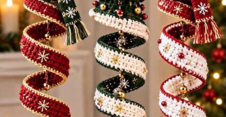 Three crochet spiral Christmas ornaments with Santa, a Christmas tree, and a snowman, each decorated with festive colors, scarves, and gold baubles.