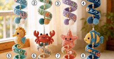 Crocheted spiral mobile featuring a blue dolphin amigurumi and underwater accents in blue and white tones.