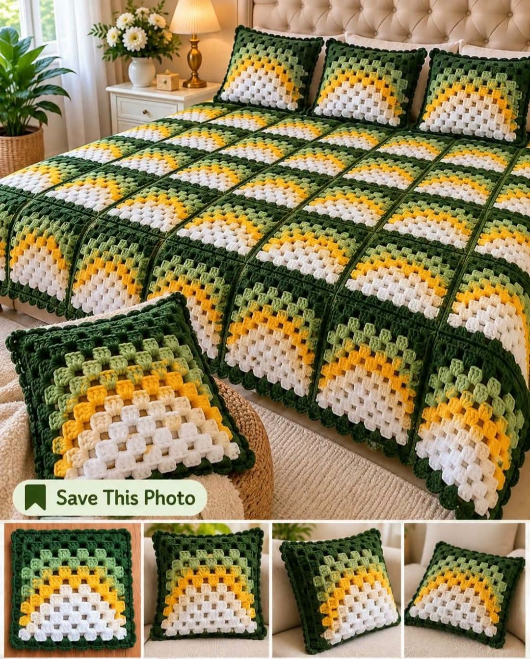 A crocheted bedspread and pillows featuring sunburst granny squares with green, yellow, and white colors on a bed.